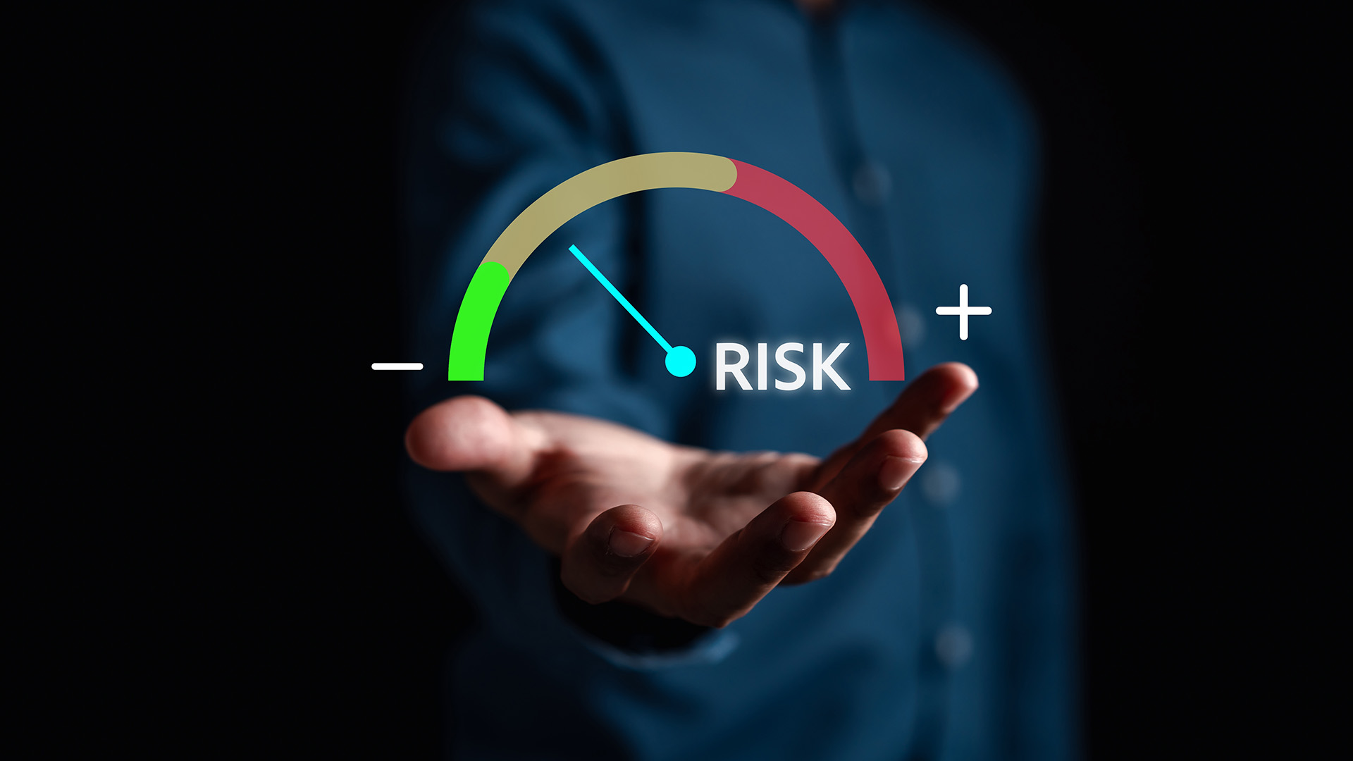 Person holding a digital risk meter gauge showing low to high risk levels, symbolizing subcontractor risk assessment and management.